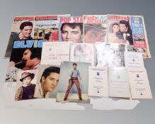 A tray containing Elvis Presley memorabilia including a signed portrait photograph (signature