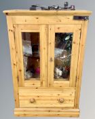 A pine double door glazed cabinet converted to a vivarium with accessories