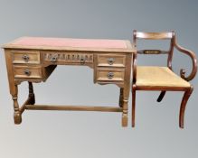 A priory oak five drawer desk with a leather inset panel,