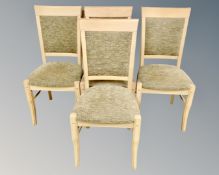 A set of four contemporary dining chairs.