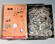 A tray containing a large quantity of silver tone costume jewellery together with costume earrings