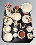 A tray containing a quantity of Torquay ware pottery.