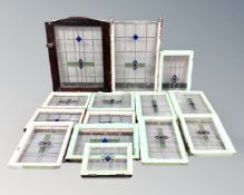 A set of 14 Victorian framed stained glass windows.