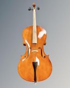A student cello in soft carry bag,