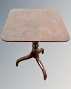 A Victorian mahogany square topped pedestal occasional table.