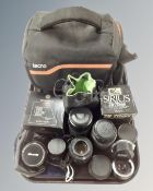 A tray containing Tecno camera bag together with a quantity of assorted camera lenses including