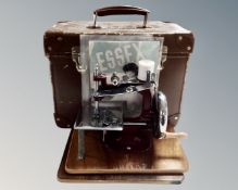 An Essex toy sewing machine in case
