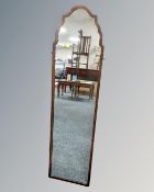 A 20th century walnut framed hall mirror.