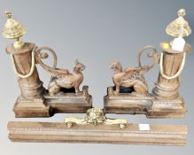 A 19th century cast iron and brass fire curb with dogs