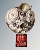 A circular plated tray containing antique and later plated wares including lidded entree dish,