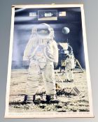 A vintage pull down poster, Apollo 11 astronauts Armstrong, Aldrin and Collins,