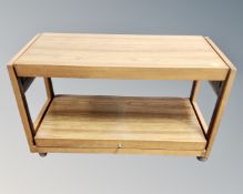 A 20th century teak and melamine two tier dumb waiter trolley.