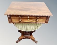 A Regency mahogany twin-drawer pedestal work table, on scroll feet, width 59cm.
