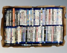 A box containing a large quantity of Blu-rays including Gremlins, Groundhog Day, Big, The Goonies,