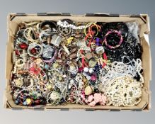 A box of a large quantity of costume jewellery including costume pearls and mourning jewellery.