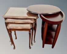A nest of three mahogany and beech glass topped tables together with a further contemporary four