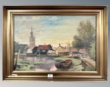 Continental School : Buildings by a lake, oil on canvas, 63cm by 42cm.