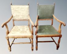 A pair of 20th century oak armchairs with acorn finials.