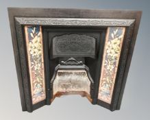 A Victorian tiled cast iron fire insert.