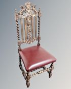 An Edwardian carved oak barleytwist dining chair.