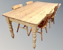 A pine farmhouse kitchen table (length 183cm) together with four chairs