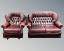 A red buttoned leather Chesterfield two seater settee with matching rocking chair.