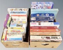Two boxes containing approximately 25 vintage jig saws.