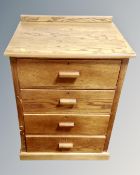 A 20th century oak and plywood four drawer chest.
