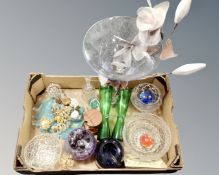 A box containing assorted glassware including paperweights, ornate vases, bowls,