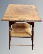 A Victorian inlaid rosewood square-topped twin-tier occasional table, on tapered legs,