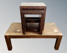 A contemporary coffee table together with a nest of two cube tables.
