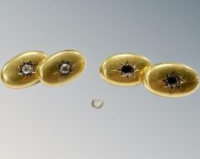 A pair of 18ct gold cuff links with inset rose-cut diamonds (one stone loose, another deficient).