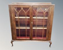 A 1930s mahogany double door glazed bookcase,