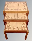 A nest of three 20th century tile topped tables,