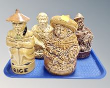 Four 20th century figural lidded storage jars, tea, coffee, sugar and rice.