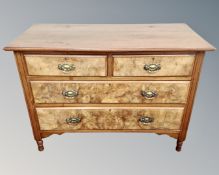 An Edwardian walnut two-over-two four drawer chest,