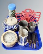 A tray containing a brass ship's compass, a jar containing glass marbles,