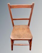 A 20th century stained child's desk chair.