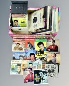 A box containing Elvis Presley vinyl records including albums, 78s and 45 singles.