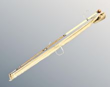 A bamboo four-piece fishing rod stamped W J Cummings Maker Bishop Auckland,