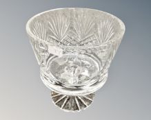 A heavy cut glass bowl on stand.