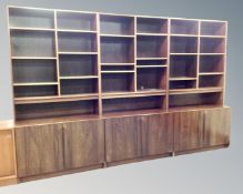 A 20th century Scandinavian rosewood veneered modular three piece bookcase.