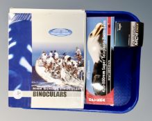 A tray containing binoculars, Opteka super telephoto zoom lens, Kenko 2x Teleplus MC4 teleconverter,