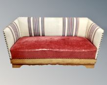 A 19th century Scandinavian two seater settee in studded upholstery,