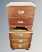 Two campaign style chests with brass drop handles.