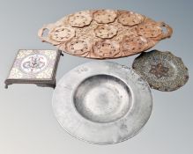 A carved wooden twin handled tray together with an antique pewter plates,