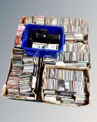 A pallet containing five boxes of assorted CDs, together with two Xbox 360 consoles (spares),