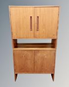 Two Scandinavian teak double door cabinets.