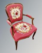 A continental carved beech salon armchair with embroidered seat.