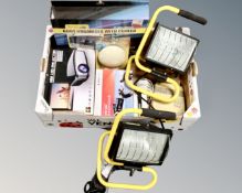 A box containing a pair of work lights, a car boot organizer, a mini LED projector,